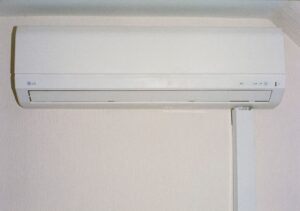 ductless mini-split indoor unit in a modern living room - is a ductless system right for your home