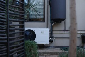heat pump tune-up outdoor unit Southern California backyard