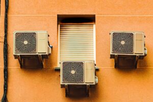 central air conditioning unit outside an Orange County home on a sunny day